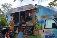 Families line up at the Kona Ice truck during Cape Coral Kiwanis KidsFest 2025.