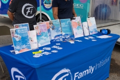 Educational materials and family support resources displayed at the Family Initiative booth during Cape Coral Kiwanis KidsFest 2025.
