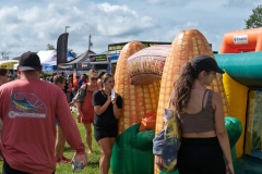 Families gather around the inflatable corn maze attraction during Cape Coral Kiwanis KidsFest 2025.