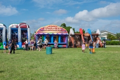 Families enjoy inflatable games and activity stations at Cape Coral Kiwanis KidsFest 2025.