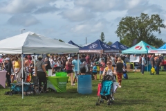 Large crowds browse vendor booths and activity areas during Cape Coral Kiwanis KidsFest 2025.
