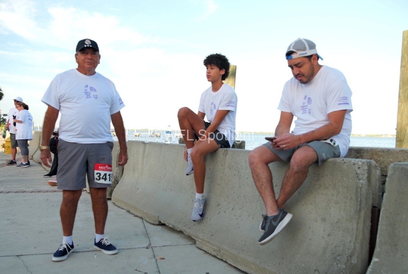 Participants gather along the Fort Myers waterfront before the Purple Color Run begins.