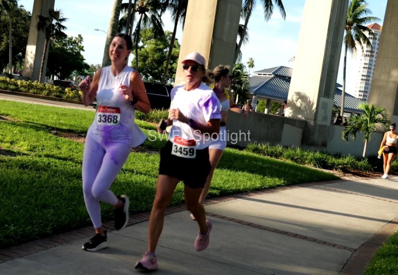 Participants gather along the Fort Myers waterfront before the Purple Color Run begins.
