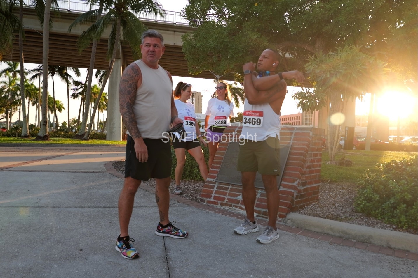 Participants warm up before the Purple Color Run at Centennial Park in Fort Myers.