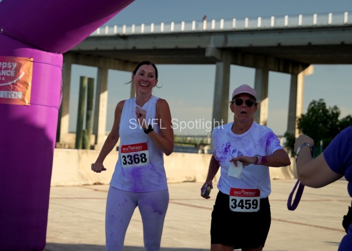 Purple Color Run participants finish the charity 5K in Fort Myers.