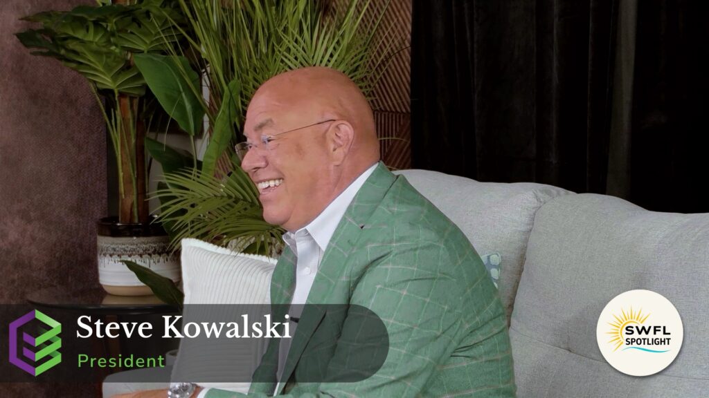 Steve Kowalski, President of Entrust Payroll Solutions, smiling during an interview inside the MelloD Designs production studio for the SWFL Spotlight Built Here series in Southwest Florida.