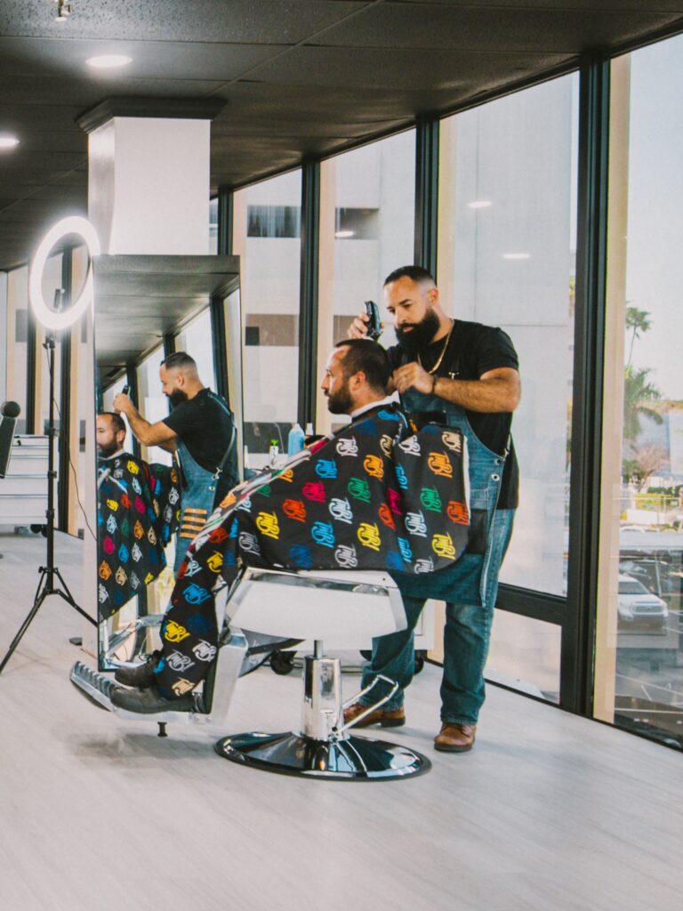 Nick Romero cuts a client’s hair inside Thank My Barber in downtown Fort Myers.
